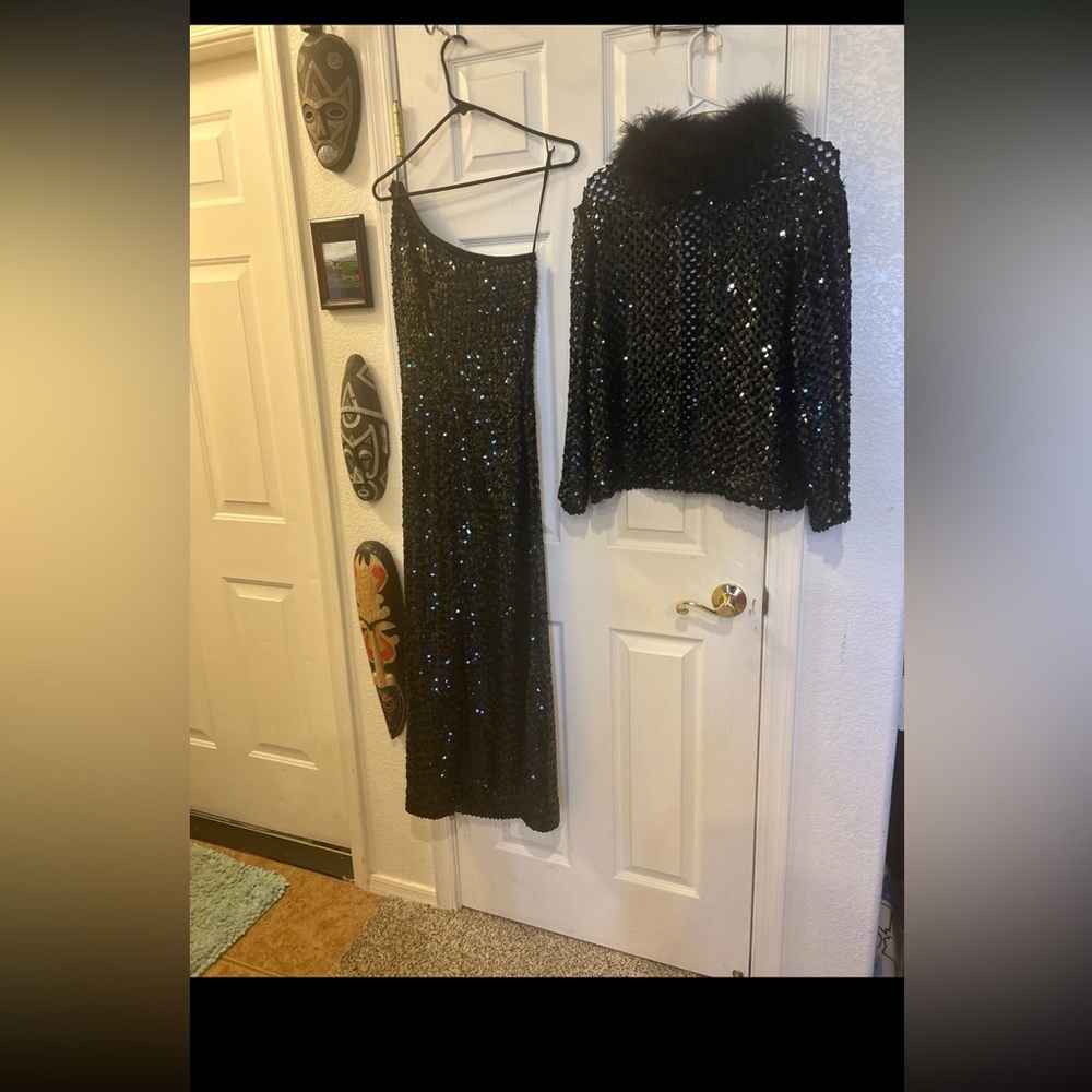 Elegant Black Asymmetrical Dress size 8-10 like new refurbished